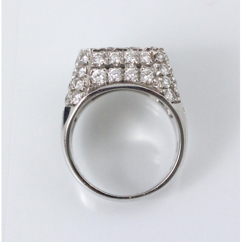 177 - An Italian white gold diamond set cocktail ring, the square shaped head with round cut diamonds set ... 