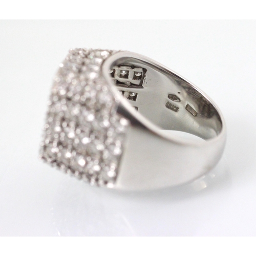 177 - An Italian white gold diamond set cocktail ring, the square shaped head with round cut diamonds set ... 