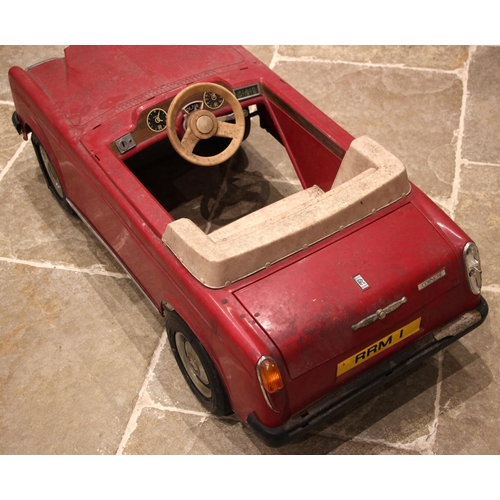 748 - A Sharna for Tri-ang pedal car in the form a Rolls Royce Corniche, circa 1980, finished in red with ... 
