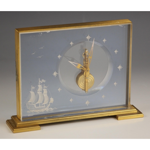 854 - A Jaeger Le Coultre Marina mantel clock, the rectangular lacquered brass and lucite panel inset case... 