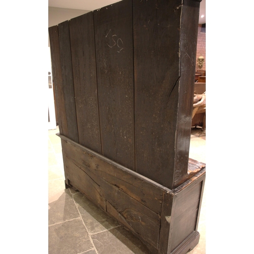 917 - A George III Conwy Valley oak dresser, the enclosed plate rack with a moulded cornice and wavy friez... 