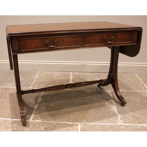 929 - A Regency style mahogany sofa table, late 20th century, the rectangular drop leaf top with rounded c... 