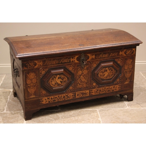 931 - An early 19th century German oak, walnut and marquetry domed marriage chest, the hinged cover openin... 