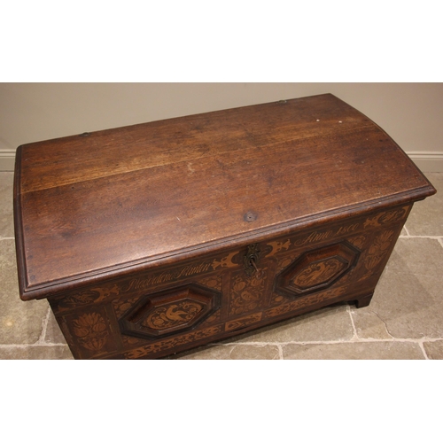 931 - An early 19th century German oak, walnut and marquetry domed marriage chest, the hinged cover openin... 