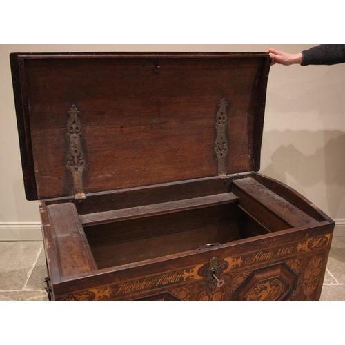 931 - An early 19th century German oak, walnut and marquetry domed marriage chest, the hinged cover openin... 