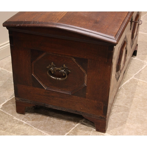 931 - An early 19th century German oak, walnut and marquetry domed marriage chest, the hinged cover openin... 