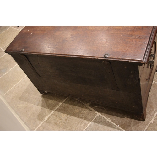 931 - An early 19th century German oak, walnut and marquetry domed marriage chest, the hinged cover openin... 