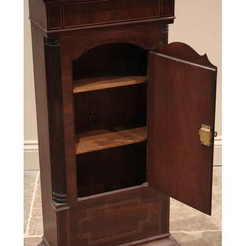 938 - A George III mahogany side cabinet, converted from a longcase clock case, the shaped door outlined w... 