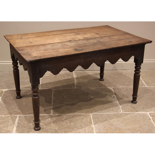 943 - A 19th century provincial oak kitchen or work table, probably Welsh, the rectangular plank top over ... 