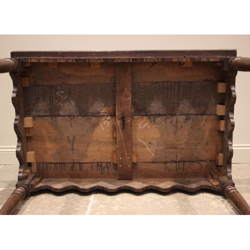 943 - A 19th century provincial oak kitchen or work table, probably Welsh, the rectangular plank top over ... 