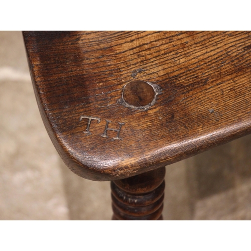 944 - A 19th century ash and elm Windsor farmhouse chair, impressed 'T.H' to the seat, the hoop back over ... 