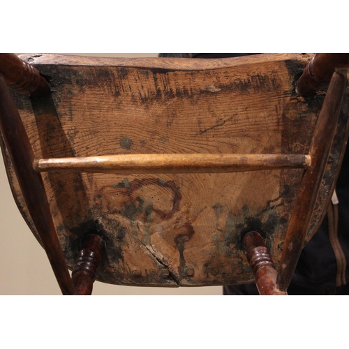 944 - A 19th century ash and elm Windsor farmhouse chair, impressed 'T.H' to the seat, the hoop back over ... 