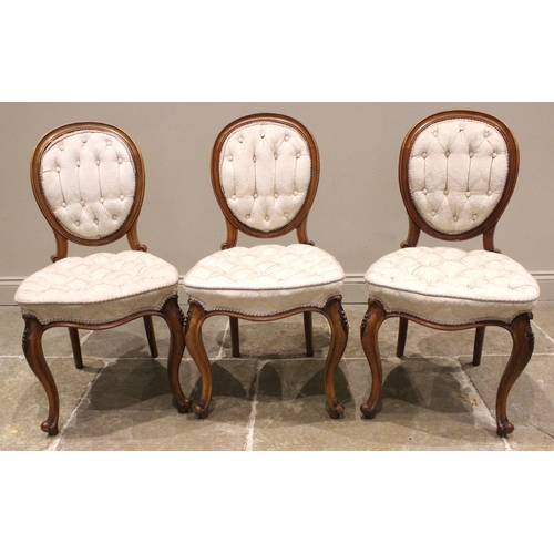 948 - A set of three Victorian walnut dining/side chairs, by John Manuel & Son, Sheffield, in the Louis XV... 