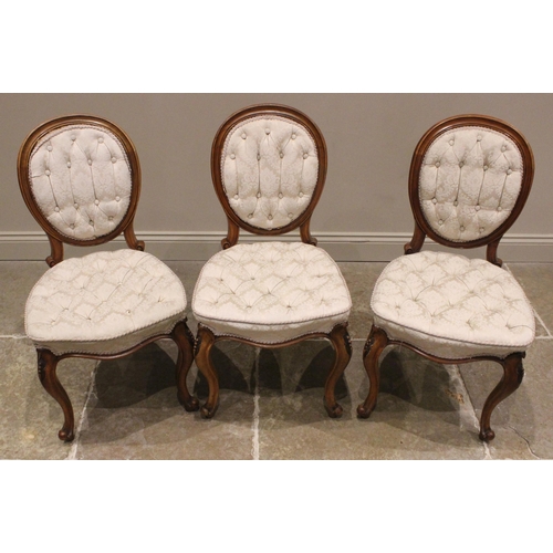 948 - A set of three Victorian walnut dining/side chairs, by John Manuel & Son, Sheffield, in the Louis XV... 