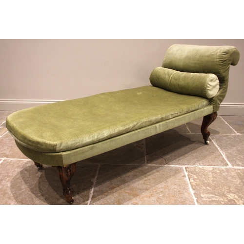 950 - A Victorian walnut day bed, in green velour upholstery, with an 'S' shaped scroll end and rounded op... 