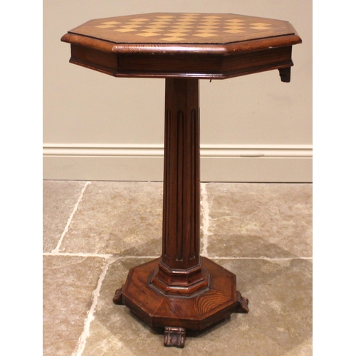 952 - A Victorian pitch pine pedestal games table, the moulded octagonal top inlaid with a chequered games... 