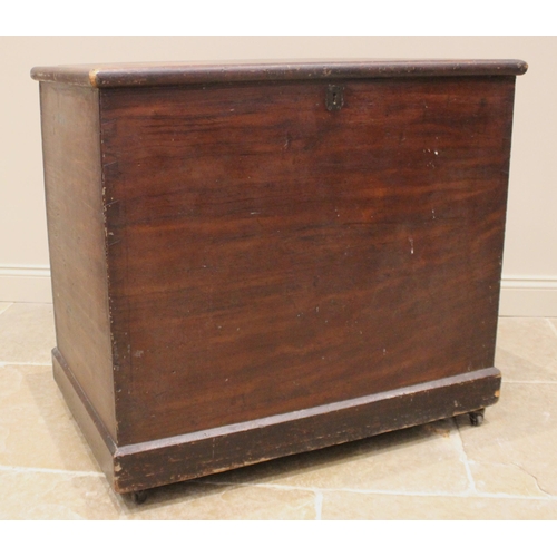 983 - A Victorian country house stained pine storage chest, the hinged cover opening to twin compartments,... 