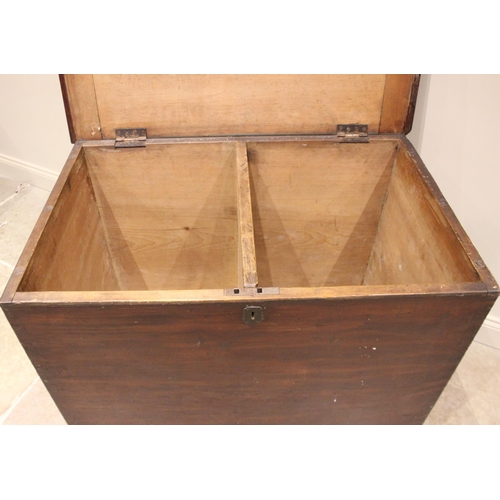 983 - A Victorian country house stained pine storage chest, the hinged cover opening to twin compartments,... 