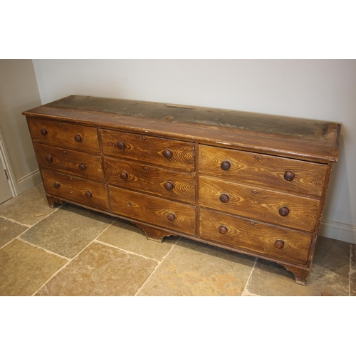 986 - A Victorian scumbled pine housekeepers cupboard, the moulded cornice over a central pair of cupboard... 