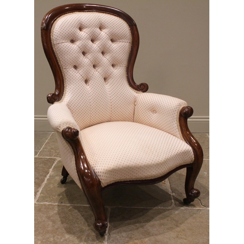 988 - A Victorian mahogany framed balloon back armchair, later re-upholstered, the button back extending t... 