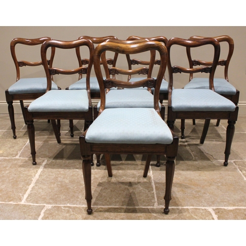 990 - A set of eight compressed balloon back rosewood dining chairs, mid 19th century, each with an acanth... 