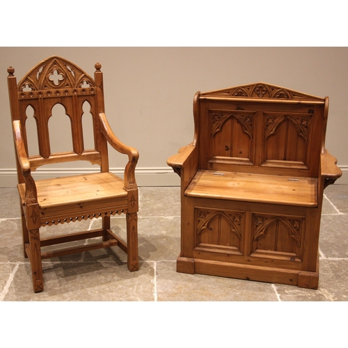 992 - A Gothic influence pine box settle, late 20th century, the architectural back rest with quatrefoil m... 