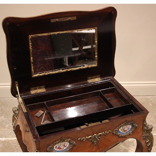 993 - A French Louis XVI style kingwood vanity or work table, late 19th early 20th century, the serpentine... 