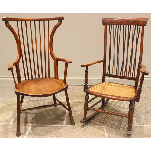 1024 - An ash Arts and Crafts Windsor elbow chair, late 19th/early 20th century, with curved top and side r... 