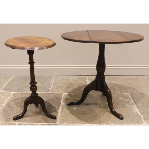 926 - A George III oak tilt top tripod table, the circular top upon a baluster column, three cabriole supp... 