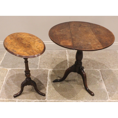 926 - A George III oak tilt top tripod table, the circular top upon a baluster column, three cabriole supp... 