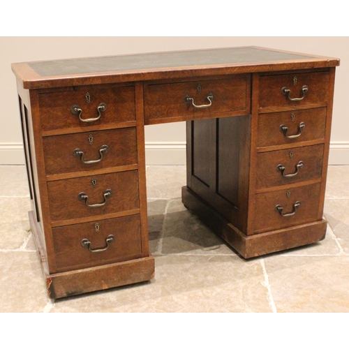 958 - A Victorian walnut twin pedestal desk, the skiver inset top over a central frieze drawer, flanked by... 