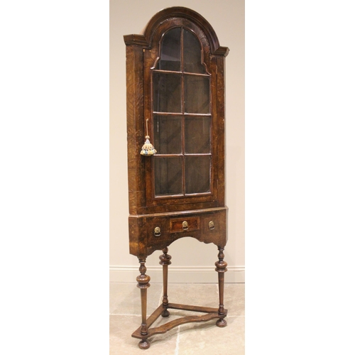 959 - A William and Mary style glazed elm corner cabinet on stand, 19th century and later, the domed and m... 