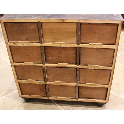 973 - A Victorian stained pine apothecary chest, formed with nine drawers, each applied with a hardwood dr... 