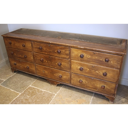 986 - A Victorian scumbled pine housekeepers cupboard, the moulded cornice over a central pair of cupboard... 