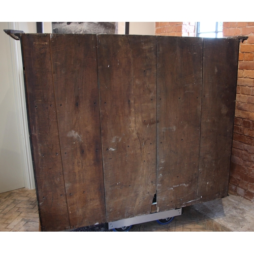 999 - A 19th century golden oak housekeepers cupboard, the oversailing cornice applied with acorn pendants... 