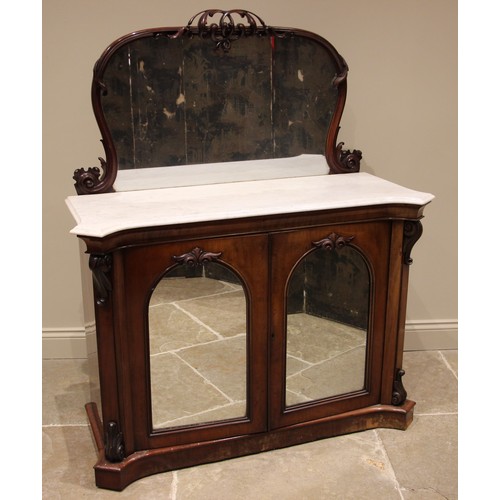 974 - A Victorian mahogany marble top, mirror back chiffonier, the arched mirror with a carved openwork sc... 