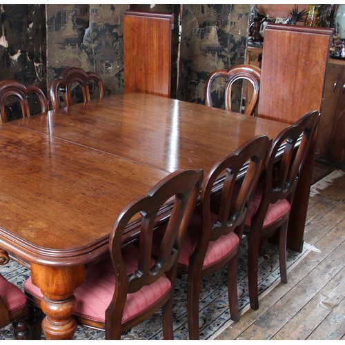 989 - A Victorian mahogany dining table, the rectangular moulded top with rounded corners upon knopped and... 