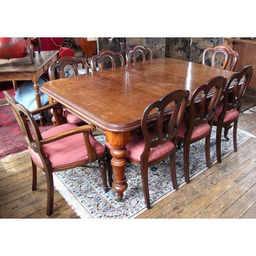 989 - A Victorian mahogany dining table, the rectangular moulded top with rounded corners upon knopped and... 