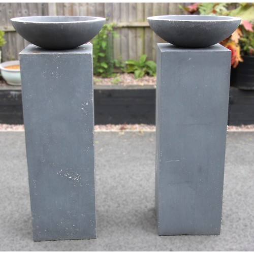 1077 - A pair of patio pedestals, of plain cubic rectangular form, 120cm H x 41cm Sq, supporting a pair of ... 