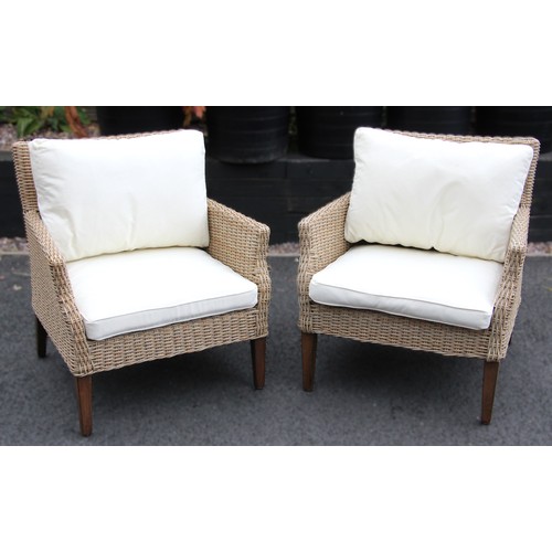 1126 - A pair of Oka Edslan outdoor dining chairs, with cushions, 82cm H x 78cm W x 72cm D (2)