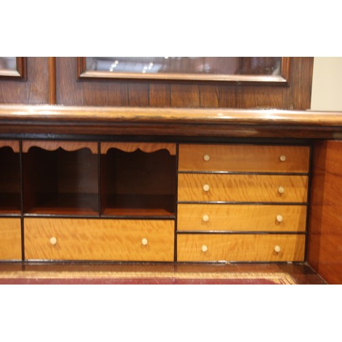 957 - A William IV rosewood secretaire library bookcase, the cavetto cornice over a pair of glazed doors a... 