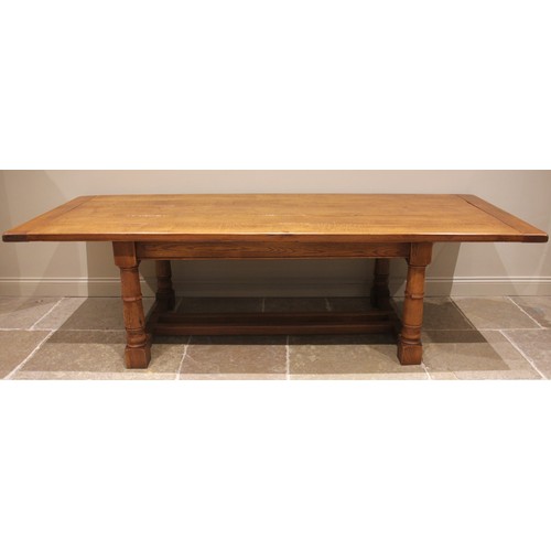 1048 - A medium oak refectory table in the 17th century style, late 20th/early 21st century, the cleated pl... 