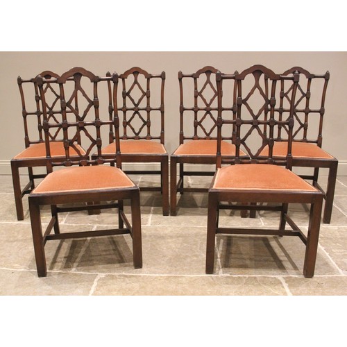 946A - A set of eight mahogany dining chairs, in the George III Chinese Chippendale style, 20th century, ea... 