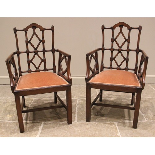 946A - A set of eight mahogany dining chairs, in the George III Chinese Chippendale style, 20th century, ea... 