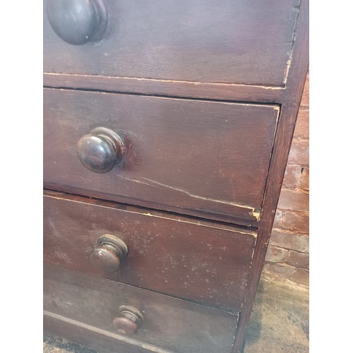 972 - A Victorian stained pine chest of drawers, formed with a rectangular moulded top over two short and ... 