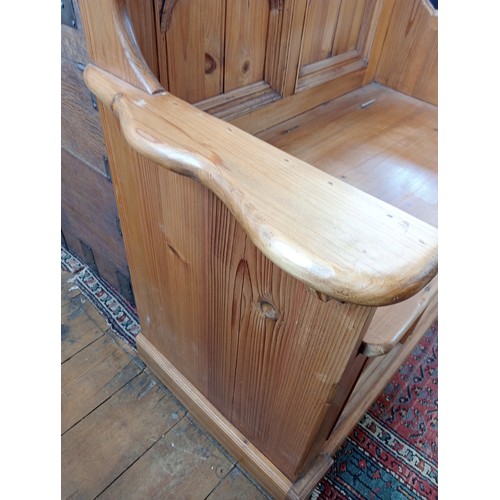 992 - A Gothic influence pine box settle, late 20th century, the architectural back rest with quatrefoil m... 