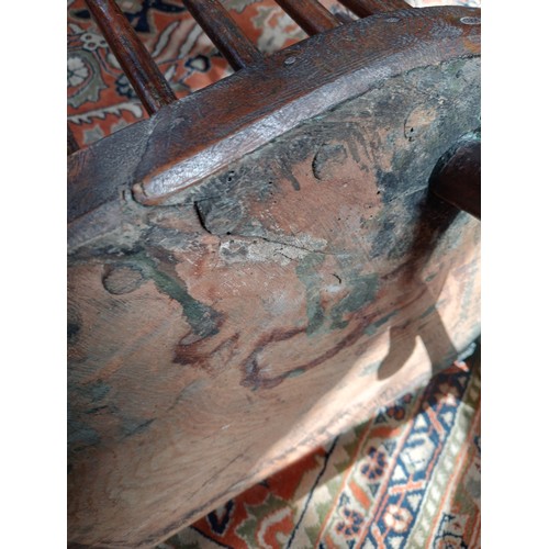 944 - A 19th century ash and elm Windsor farmhouse chair, impressed 'T.H' to the seat, the hoop back over ... 