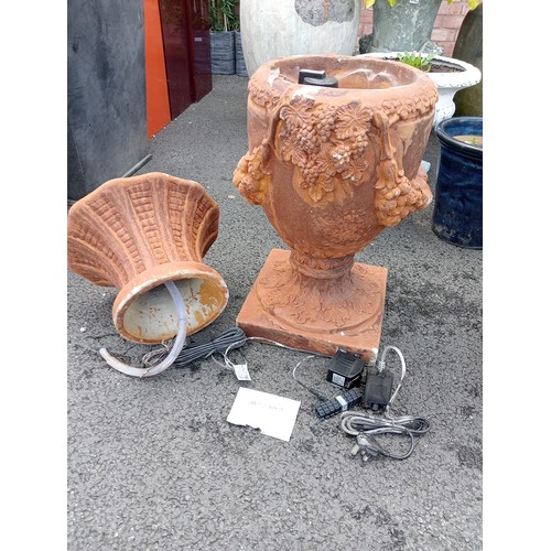 1079 - A pair of composite fibreglass simulated terracotta garden water features, modelled as garden urns w... 