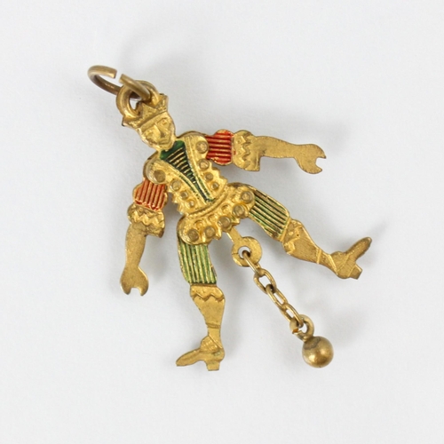 109 - An early 20th century gold plated and enamel jester charm, the articulated charm with green and red ... 