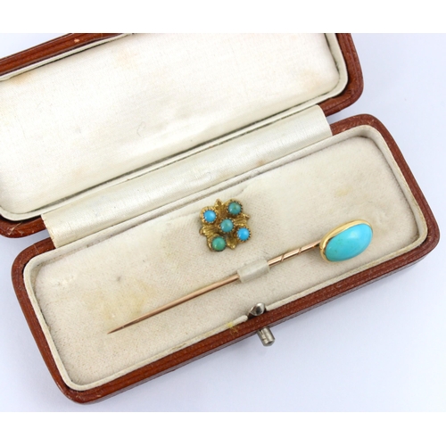 111 - An early 20th century turquoise set stick pin, the horse shoe shaped stick pin with eleven graduated... 